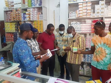 The PMS team undertakes regulatory activities in a pharmacy in Liberia