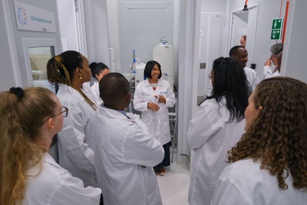 Cary Fenner, executive director of the mRNA Hub at Afrigen Biologics, leads a tour